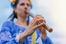 Woman Playing Woodwind Wooden Flute - Ukrainian Sopilka