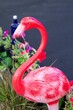 plastic pink flamingo up close out of focus with grain