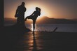 Silhouettes of a man and a woman on the beach fighting with each other at sunset