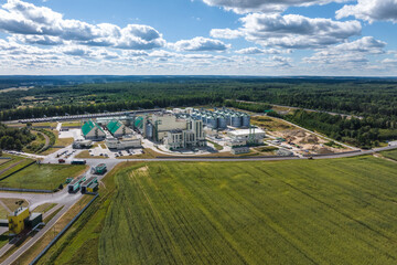 Wall Mural - aerial view on rows of agro silos granary elevator with seeds cleaning line on agro-processing manufacturing plant for processing drying cleaning and storage of agricultural products