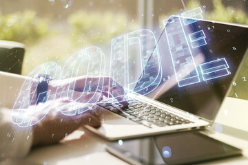Wall Mural - creative code word hologram and hands typing on computer keyboard on background, artificial intellig