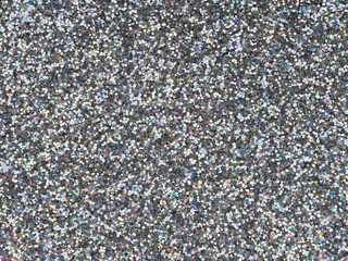 Wall Mural - Holographic bright light grey glitter texture. Background or pattern of sparkling shiny glitter for decoration and design of unusual Christmas, New Year, xmas gift card or other holiday pictures.