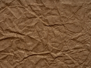 Poster - Crumpled brown paper background. Texture, pattern for handcrafts, new year designs decoration, text, lettering, wall screen saver or other art work. Old sheet of packing material closeup.