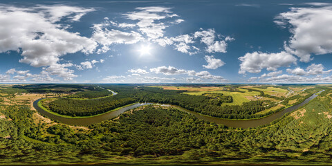 aerial full seamless spherical hdri 360 panorama view over meandering river and forest in sunny summer day and windy weather with beautiful clouds in equirectangular projection, VR content