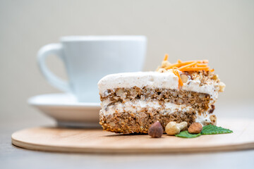 Wall Mural - carrot cake and a mug of coffee on a wooden tray