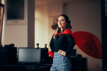 Happy Superhero Businesswoman Wearing A Red Cape In The Office. Super Heroine Female Manager Showing Strength And Confidence
