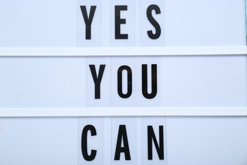 Wall Mural - Lightbox with phrase Yes You Can, closeup. Motivational quote