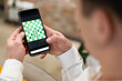 friends play chess on their smartphones online.