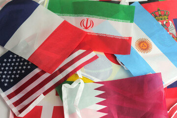 leather soccer ball with international team flags of the participating countries in the championship