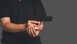 A man holding a gun ready to shoot for self-defense the criminal concept