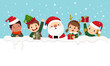 Kids in Christmas costumes and Santa Claus looking out from behind empty blank. Christmas card