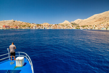 Wall Mural - Boat travel to picturesque Halki island in Greece