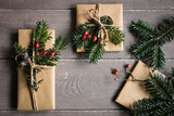 Fototapeta  - Naturally wrapped Christmas presents decorated with spruce twigs
