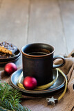 Fototapeta  - Studio shot of cup of coffee with twigs, Christmas ornaments and gingerbread
