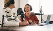 © Jacob Lund - Podcasters laughing happily on their show