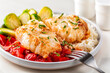 Baked cod fish, with tomato, brussel sprouts and boiled rice. Balanced food concept. Close-up.