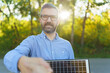 © Halfpoint - Businessman holding selling solar panel,shaking hand with customer.