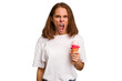 © Asier - Young caucasian woman holding an ice cream isolated screaming very angry and aggressive.