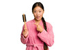 © Asier - Young asian woman holding an hair comb isolated pointing to the side