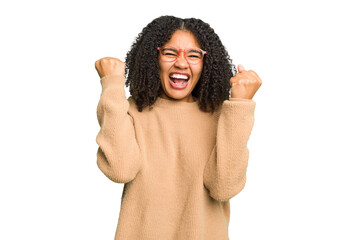 Wall Mural - Young african american woman isolated cheering carefree and excited. Victory concept.