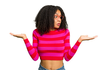 Young african american woman isolated confused and doubtful shrugging shoulders to hold a copy space.