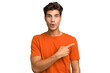 © Asier - Young caucasian handsome man isolated pointing to the side