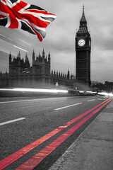 Fototapete - Big Ben during a evening with lights of cars anf flag of England in London, United Kingdom