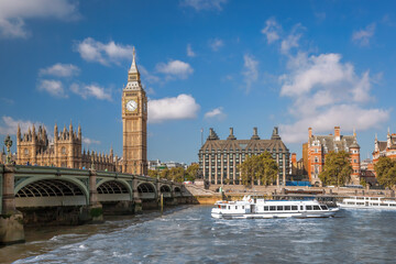 Fototapete - Famous Big Ben with bridge over Thames and tourboat on the river in London, England, UK