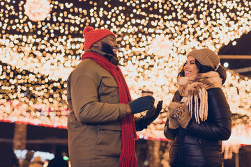 Poster - Portrait of attractive cheerful couple friends friendship visiting international festal fair sale talking drinking latte city urban outdoors