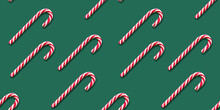 Seamless Pattern Of Christmas Candy Cane On A Green Background. Flat Lay. Xmas Flyer Or Greeting Card.