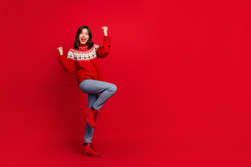 Canvas Print - Full size photo of crazy satisfied girl raise fists shout yeah empty space isolated on red color background