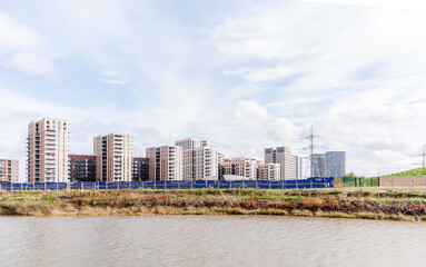 Wall Mural - london, united kingdom, october 22, 2022: canning town residential development on the river lea at canning town, london