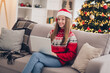 Photo of cheerful sweet girl sitting couch use netbook toothy smile enjoy festive miracle spirit indoors
