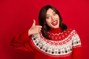 Wall Mural - Photo of positive funny optimistic girl with straight hairstyle wear red sweater show thumb up good job isolated on red color background