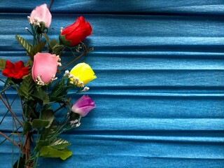 Wall Mural - bouquet of flowers on blue background