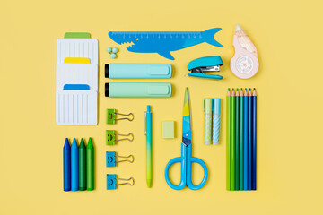School stationery is arranged neatly on yellow background.  Concept back to school. Workplace organization