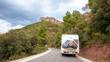 motor home- campervan caravan vehicle on the mountain road