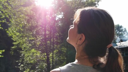 Canvas Print - Meditation in nature. Beautiful young woman in mountains on sunny day, closeup