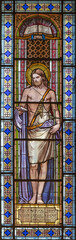 Fototapete - ALAGNA, ITALY - JULY 16, 2022: The John the Baptist in the stained glass of church  San Giovanni Battista by O. Janni from begin of 20. cent.