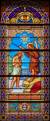 Fototapete - ALAGNA, ITALY - JULY 16, 2022: The Baptism of Christ in the stained glass of church  San Giovanni Battista by O. Janni from begin of 20. cent.
