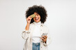 © (JLco) Julia Amaral - Happy young woman holding a credit card and a smartphone
