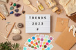 Lightbox with text trends 2023 and personal life objects. Popular tendencies and trends for wellbeing and lifestyle for new year idea