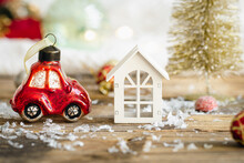 Christmas Toy Car And Details Of Christmas Decor On A Blurred Background.