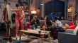 © Gorodenkoff - Television Sitcom Concept. Four Diverse Friends having Fun in the Living Room. TV Show Funny Sketch about Woman Explaining Things. Comedy Series on Network Channel or Streaming Service.