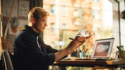 Leinwandbilder - Young Creative Male Designer Customising Sneaker by Painting Them on his Workplace. Generation Z Freelancer Creating Organic Design Shoes. Millennial Business People Concept.