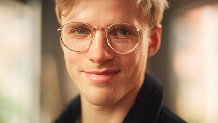 Aufkleber - Close-up Portrait of Handsome Blonde Man in Glasses, Looking at the Camera, Smiling. Thoughtful, Attractive Teen Male Sincerely Looking at You. Human Emotions and Stylish People Concept.