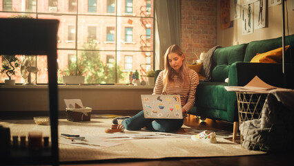 Poster - Woman Using Laptop at Home, Does Remote Work. Smiling Female Sitting on the Floor, Working with Papers, Documents, Brainstorming Creative Project with Research. Productivity in Sunny Living Room.