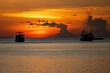 Scenic view of sunset in a sea and silhouettes of ships