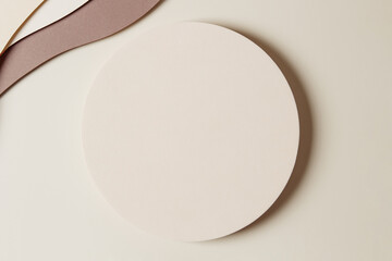 blank round beige geometric shape podium platform on paper cut abstract minimal geometric shape ligh