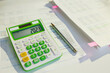 © Alliance - tax time. calculator and documents on desk